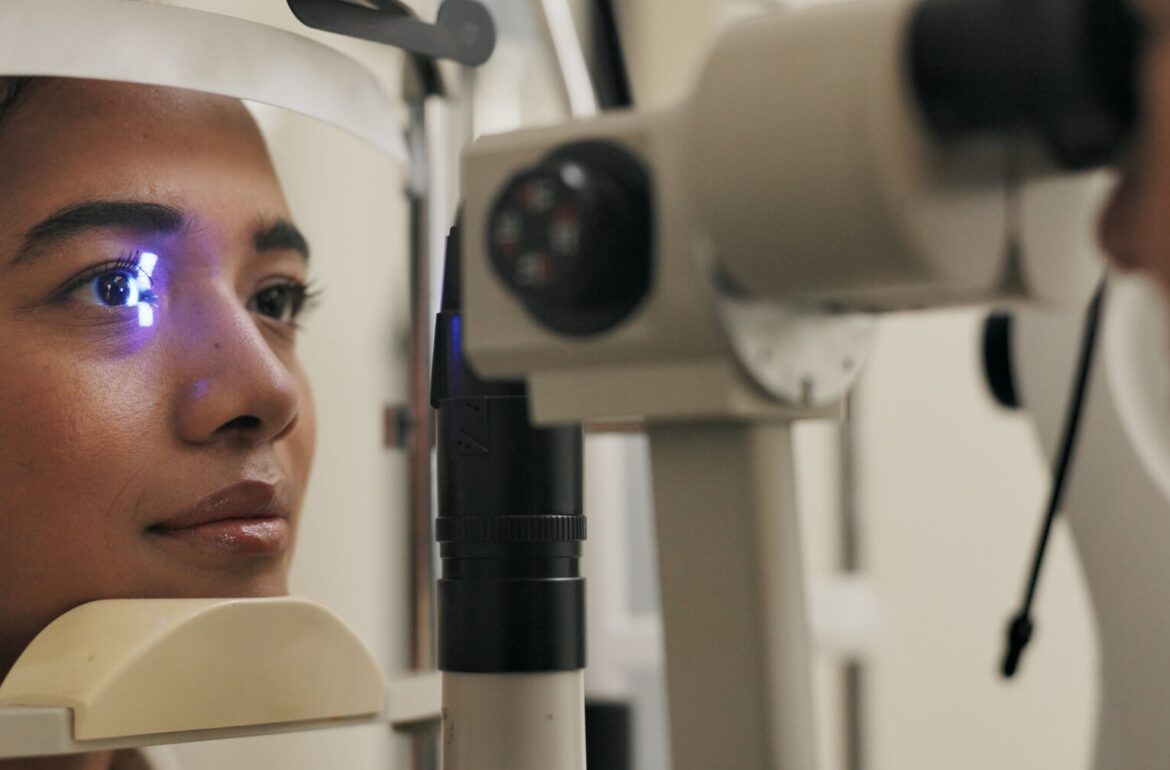 Close-up of an eye exam using a slit lamp light to check for early signs of diabetic retinopathy